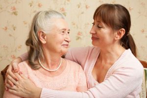 Senior woman with their caregiver at home