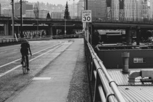 A biker riding on a bridge