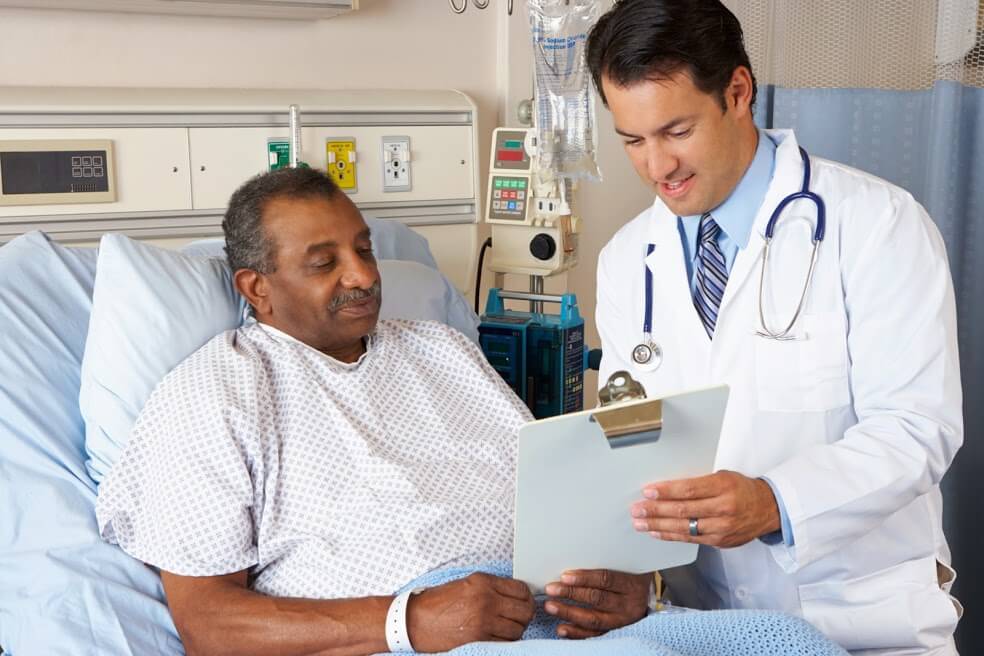 A doctor and patient reviewing a chart