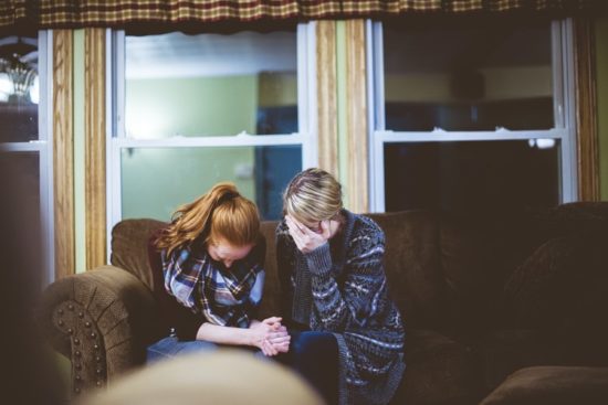 two women sitting together