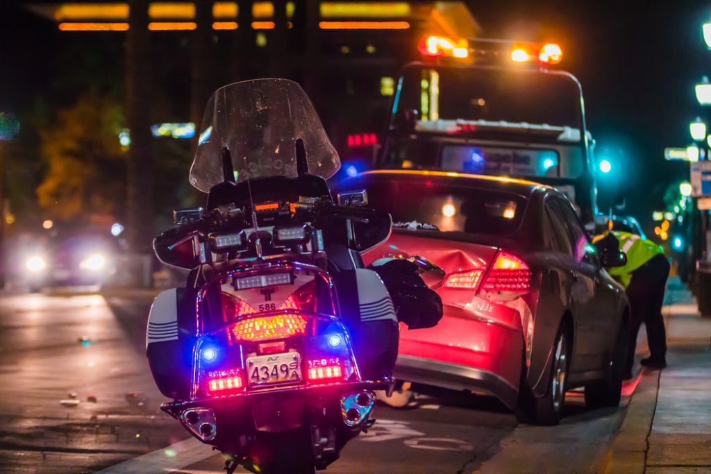 Police motorcycle at the scene of a car accident