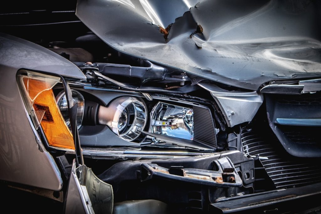 Front end of car and headlights damaged after car accident