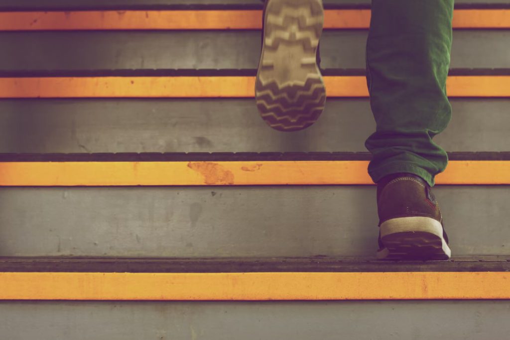 Person walking up flight of stairs